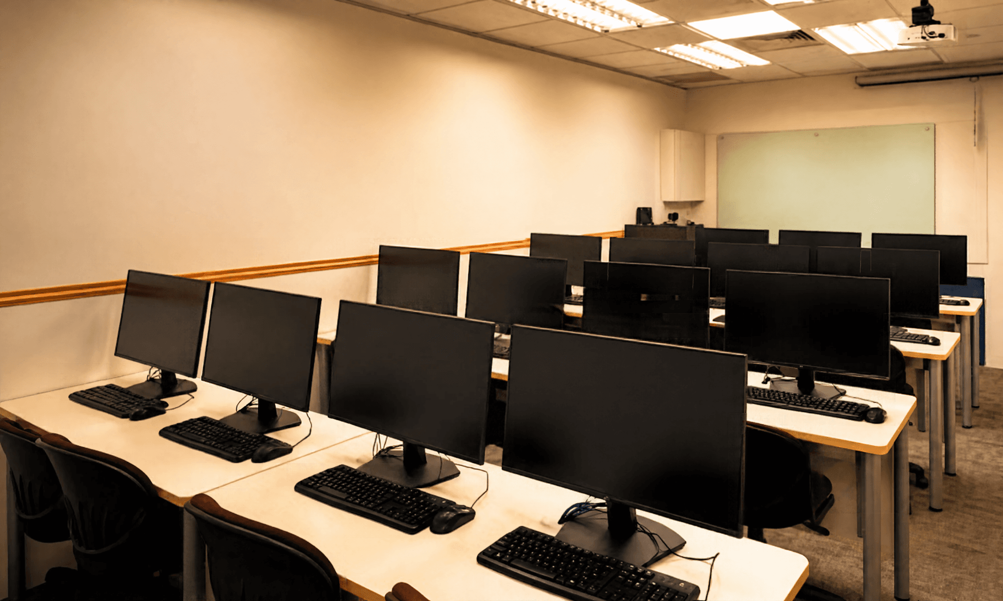 Tech Training Room desktops facing the whiteboard