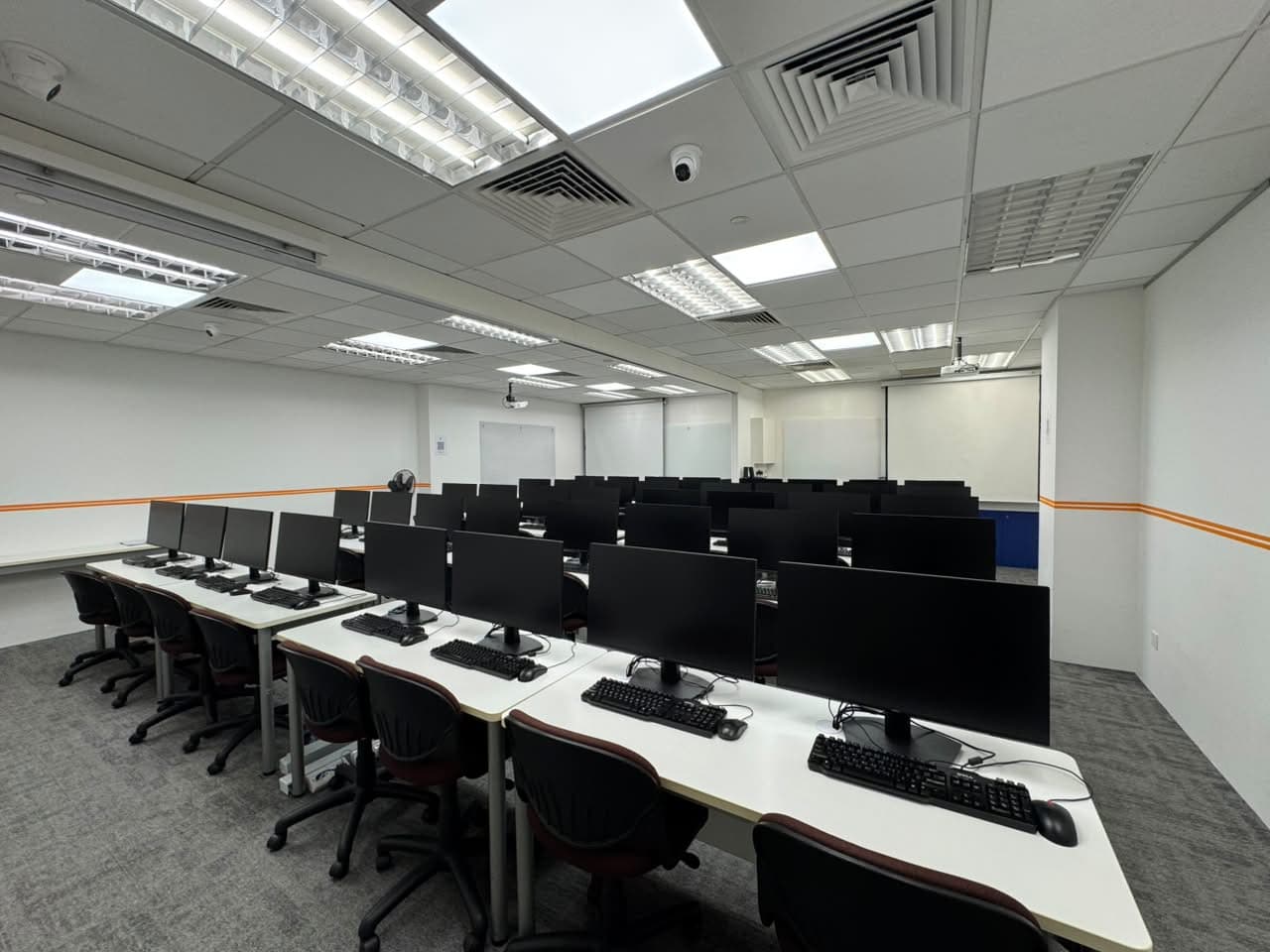 ITEL computer training room with rows of desktop workstations