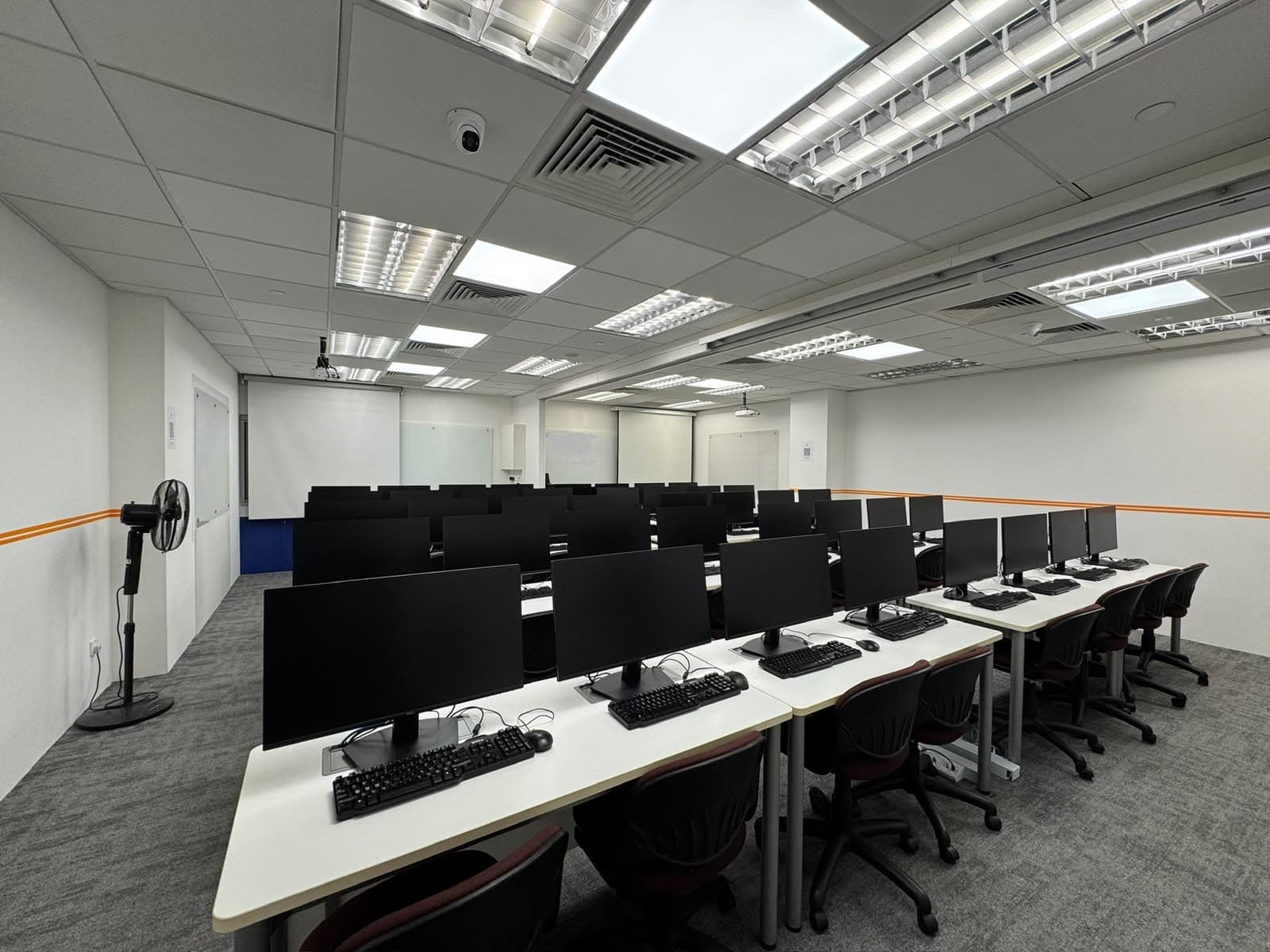 ITEL computer training room with rows of desktop workstations
