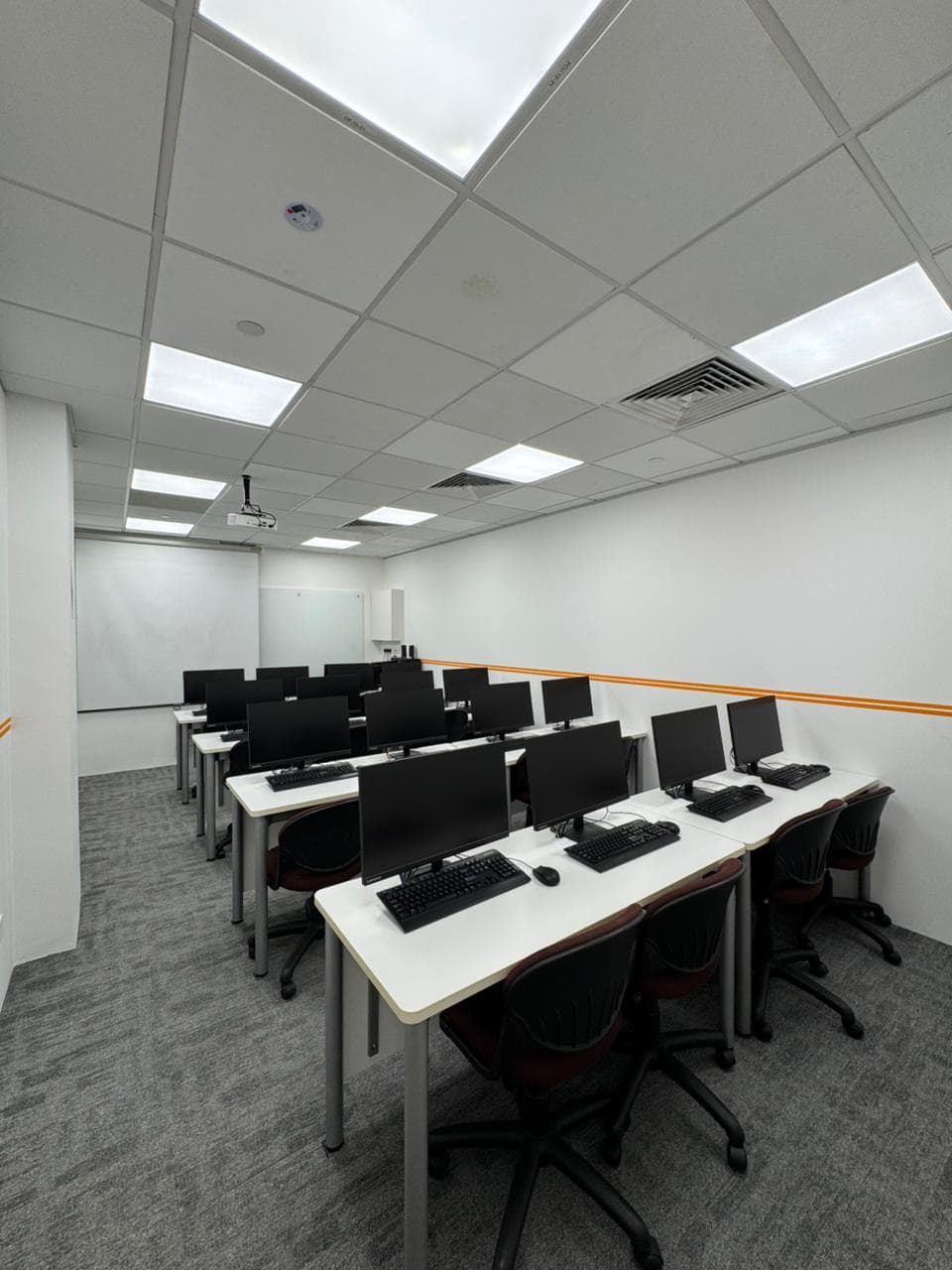 ITEL computer training room with rows of desktop workstations